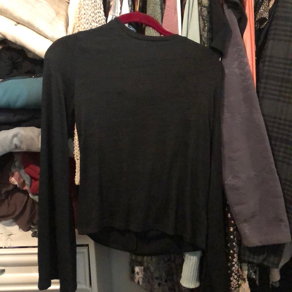 Black dress shirt that is comfy and soft. Cute bow in the back!